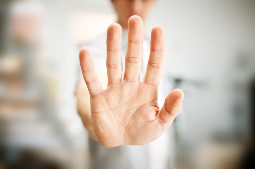 Man performing stop gesture with hand